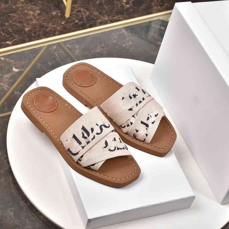 

2021 The latest beach mules flat slippers sneakers progettista ladies alphabet fabric outdoor leather sole sandals
