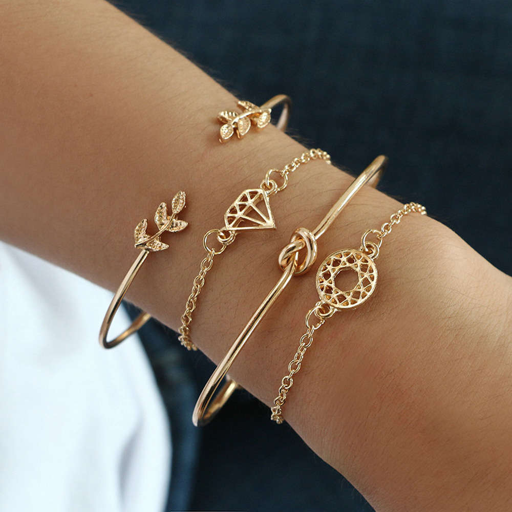 

Hand catenary 4 leaf knot hollowed out women's bracelet accessories, Golden;silver
