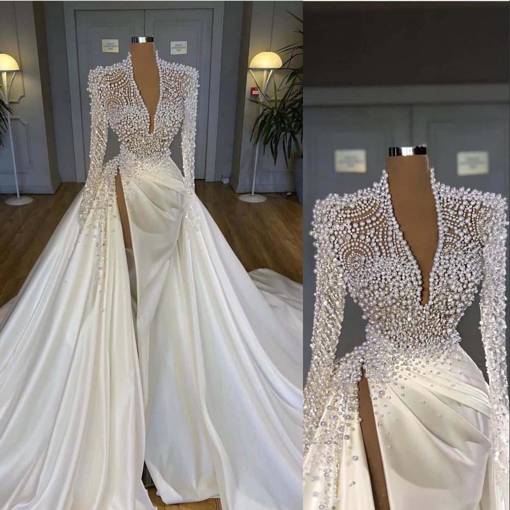 

2022 Luxury Bling Mermaid Wedding Dresses Deep V Neck Illusion Pearls Crystal High Side Split Arabic Satin Bridal Gowns Robe de mariée Plus Size Long Sleeves, White