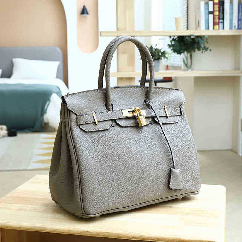 

CLASSIC FLOWER Inside and outside genuine leather platinum bag women's bag, inside is also the first layer of cowhide handbag, high-grade large GXR6, Hlc2040 brick red