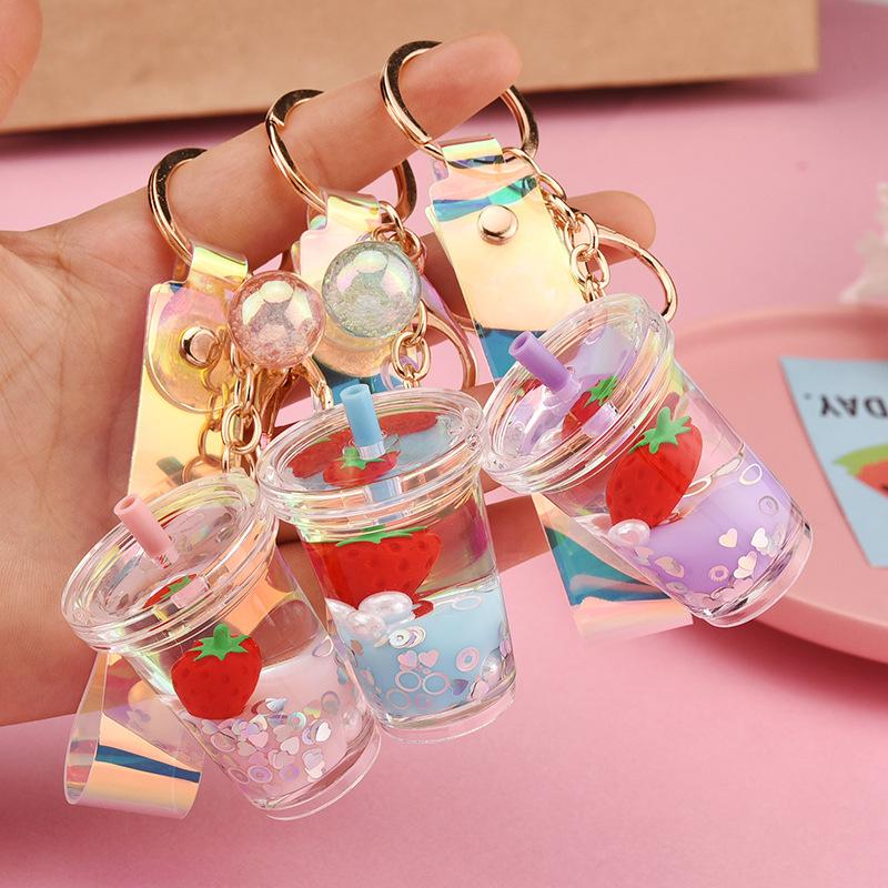 

Keychains Creative Fruit Strawberry Milk Tea Cup Keychain Floating Quicksand Acrylic Keyring Women Men Car Bag Pendant Key Holder Gifts