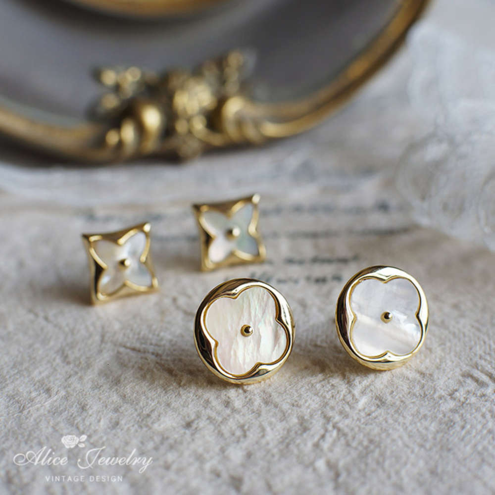 

Advanced sense female 925 pure silver needle Korean temperament super fairy natural shell lucky grass flower Earrings ins, Black