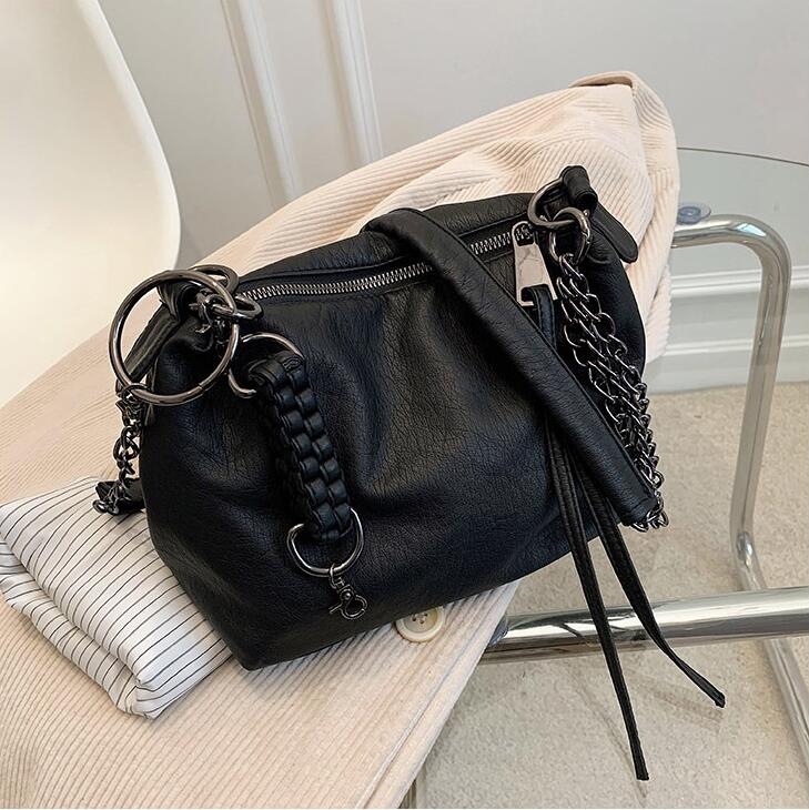 

Wholesale retro soft leathers shoulder bags simple atmosphere solid color leather handbag outdoor leisure backpack personalized woven pendant fashion pillow bag
