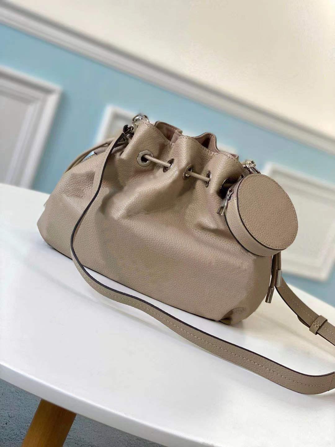 

Bag desirable Bella bucket in Mahina calf leather perforated pattern Drawstring attached round coin purse bucket M57070 M55798
