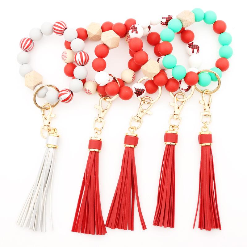 

Jewelry 17 Colors Christmas Wooden Tassel Bead String Bracelet Xmas Keychain Food Grade Silicone Beads Bracelets Women Girl Key Ring Wrist Strap