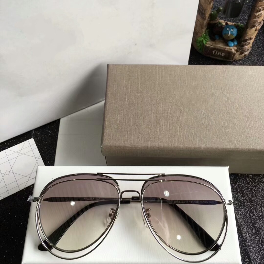 

Latest selling popular fashion STELLAIRE temperament women sunglasses mens sunglassess Gafas de sol top quality sun glasses UV400 lens