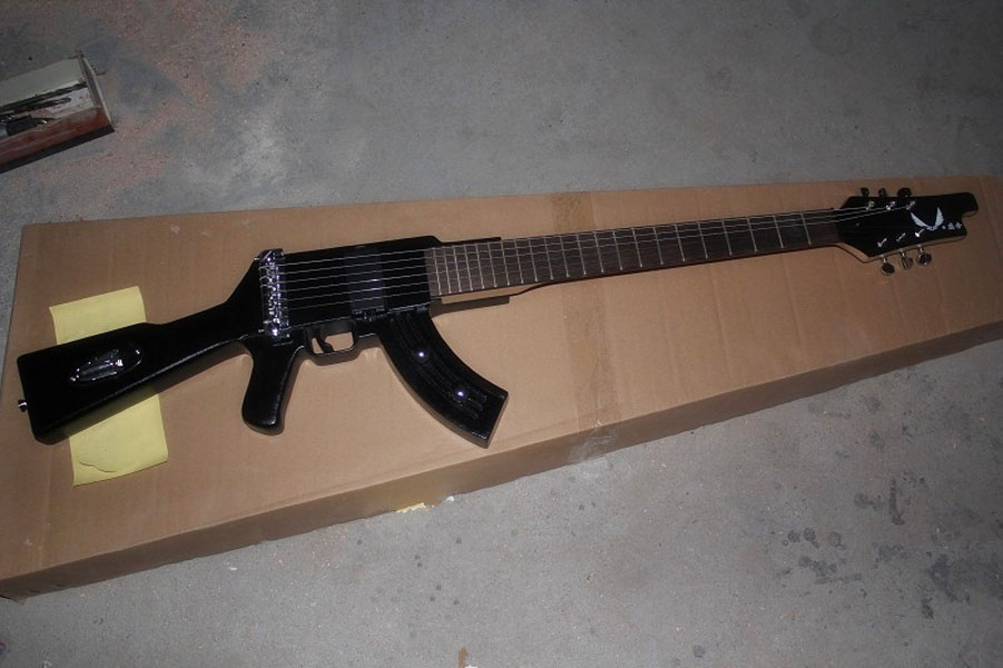 

Special-shaped gun electric guitar black memorial can be customized to change upon request