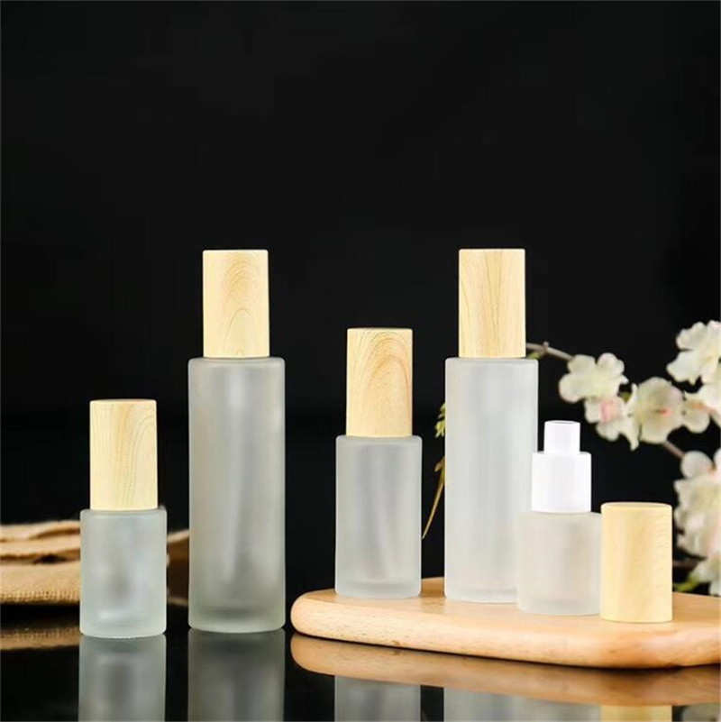 

Frosted Glass Bottle Cream Jar with Imitated Wood Lid Lotion Spray Pump Bottles Refillable Cosmetic Container Jars 20ml 30ml 60ml 80ml 100ml