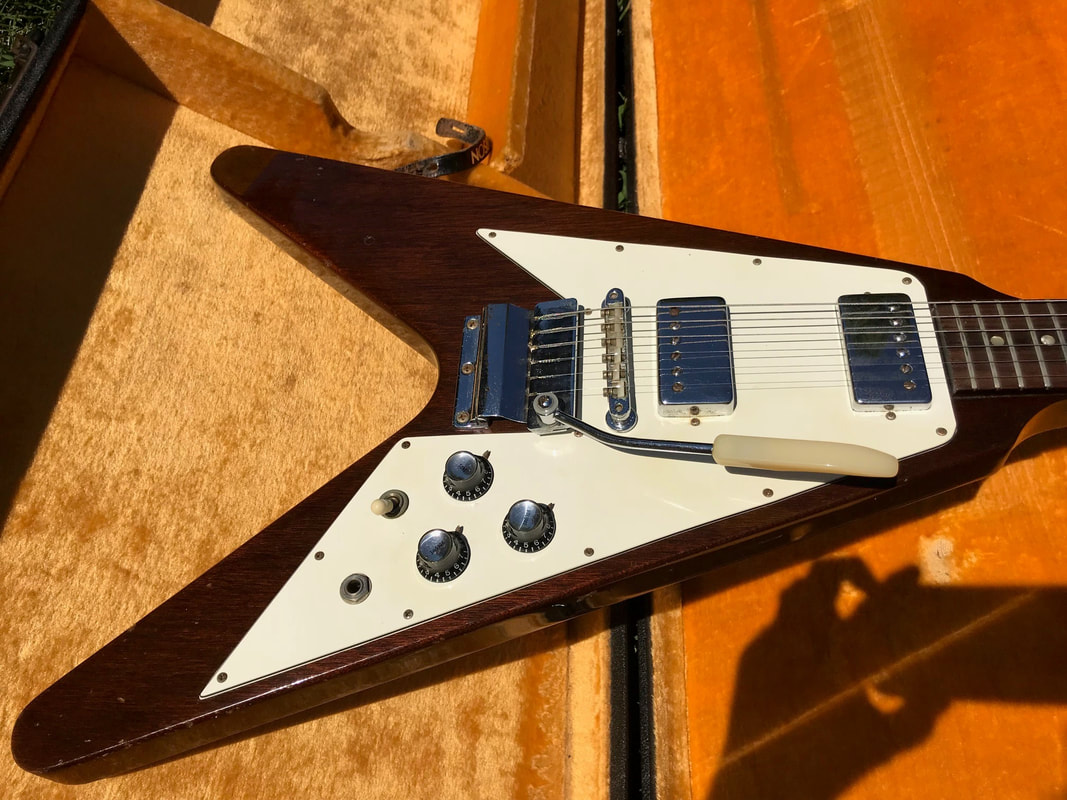 

Rare Marc Bolan Christies Auction Walnut Brown Fly V Electric Guitar Harmonica Vibrola Tremolo Bridge, Chrome Hardware, Tuilp Tuners