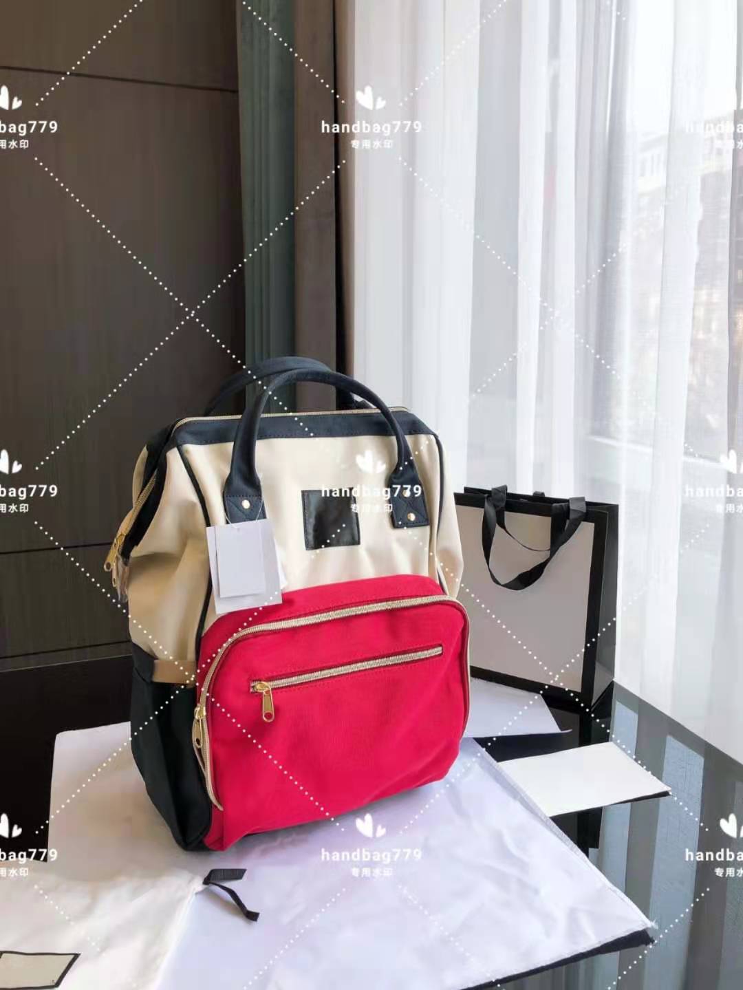 

High grade Backpack splicing collision color ticket clip type zipper opening multi pocket design hand shoulder back extra large capacity mother bag