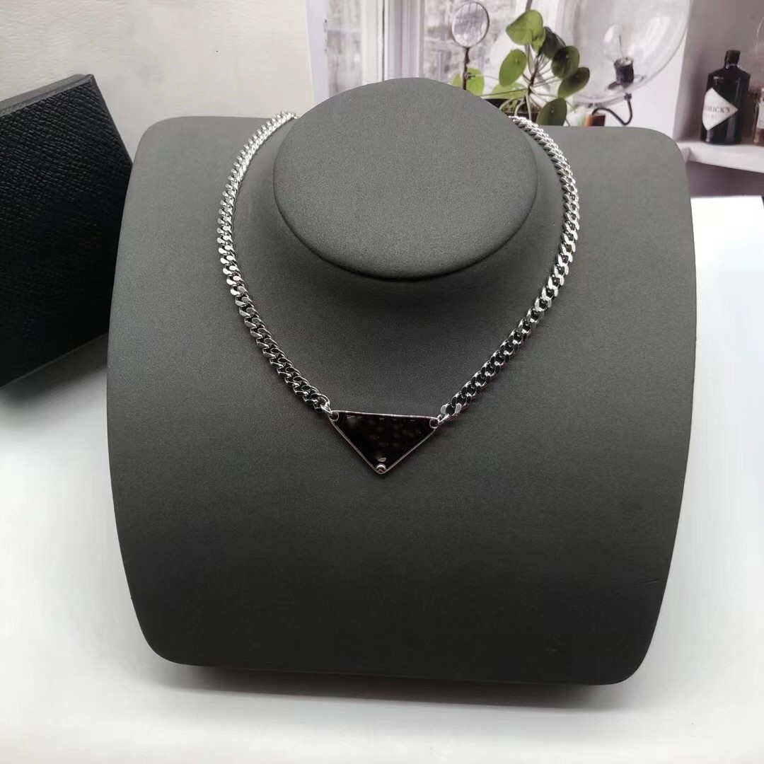 

2021 Korea wild personality letter necklace triangle brand pendant hip hop street men and women clavicle chain set high quality fast delivery