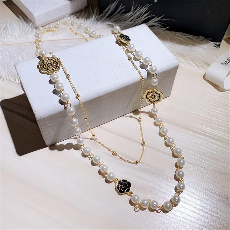 

Personality And Fashion Luxury Hollow Camellia Pearl Pendant Flower Sweater Chain Necklace For Women Chains