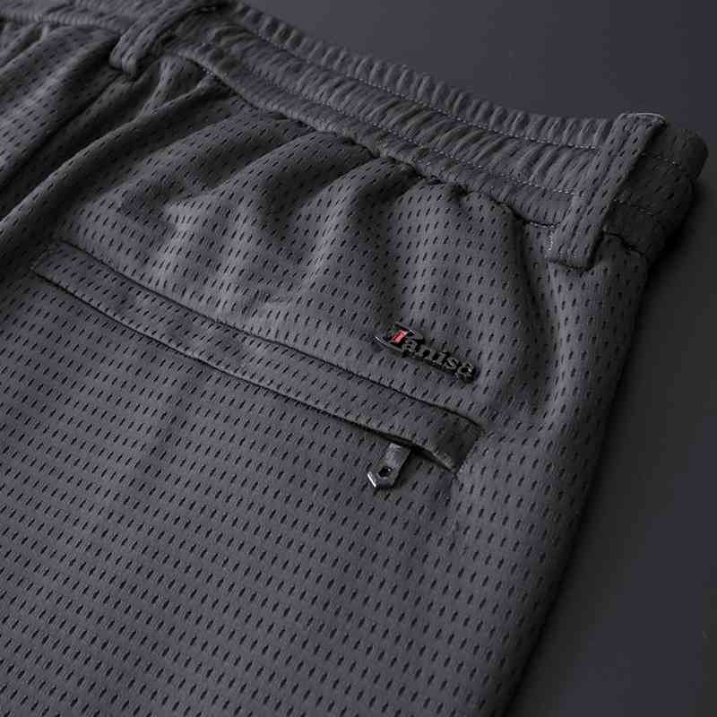 

Quality summer thin ice silk casual breathable loose mesh elastic men's quick drying air conditioning pants, Black