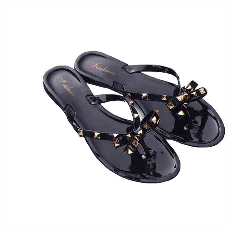 

Zapatillas nuevas de moda de verano 2019 para mujer, chanclas con lazo y remache, zapatos de gelatina planos salvajes, sandalias y, Beige
