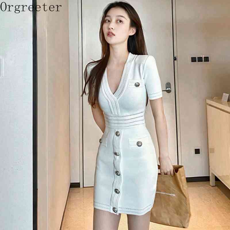 

White Deep V-neck Hollow out Knitted Sheath Pencil Dress Women Short Sleeve Single-breasted Bottoming Bodycon Mini Sweater 210525
