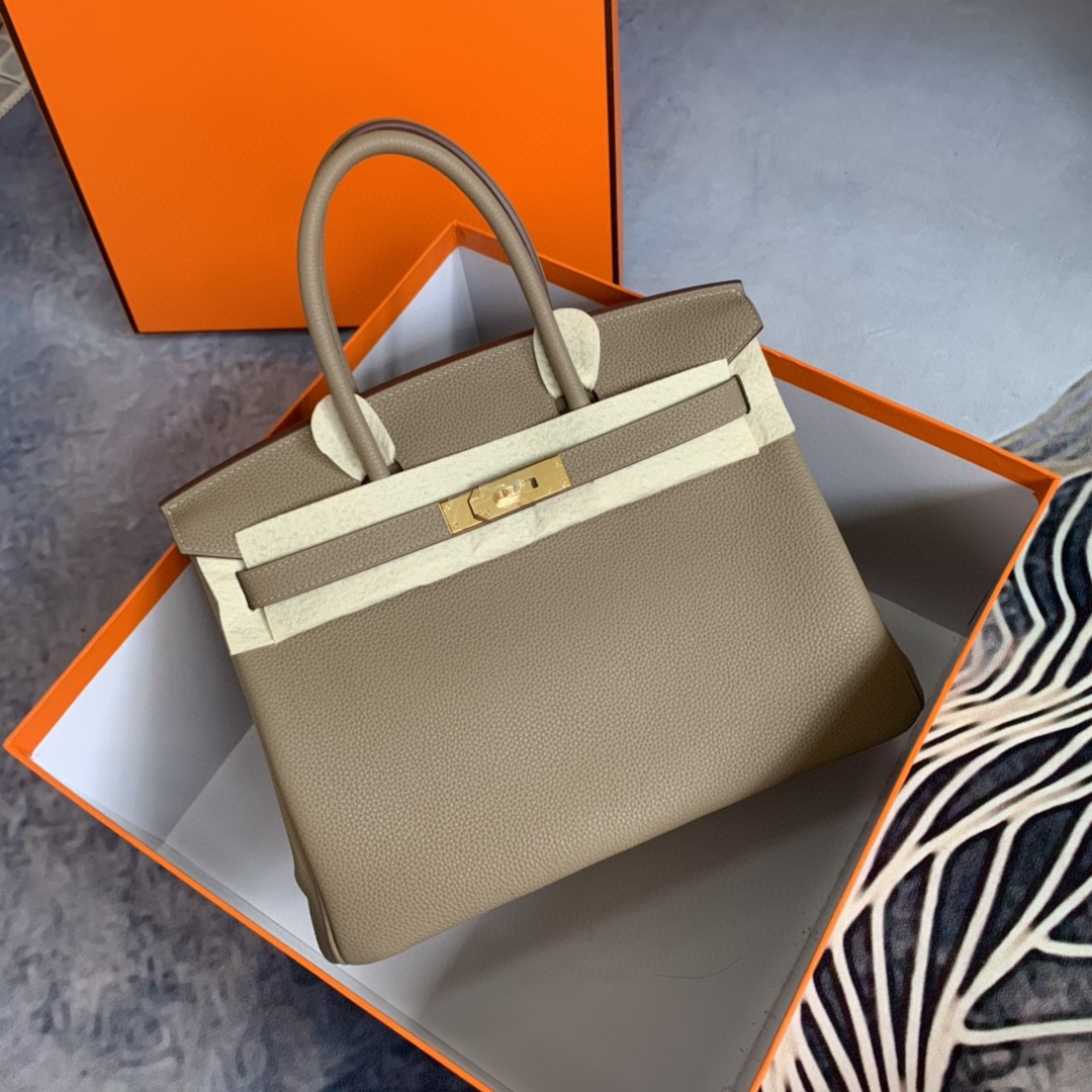 

Fully handmade,Brand purse,25cmcm,Togo leather,luxury handbagTrench,Black,brown,craie,etaupe 9COLORS,wax line stitching,Silver or gold hardware,