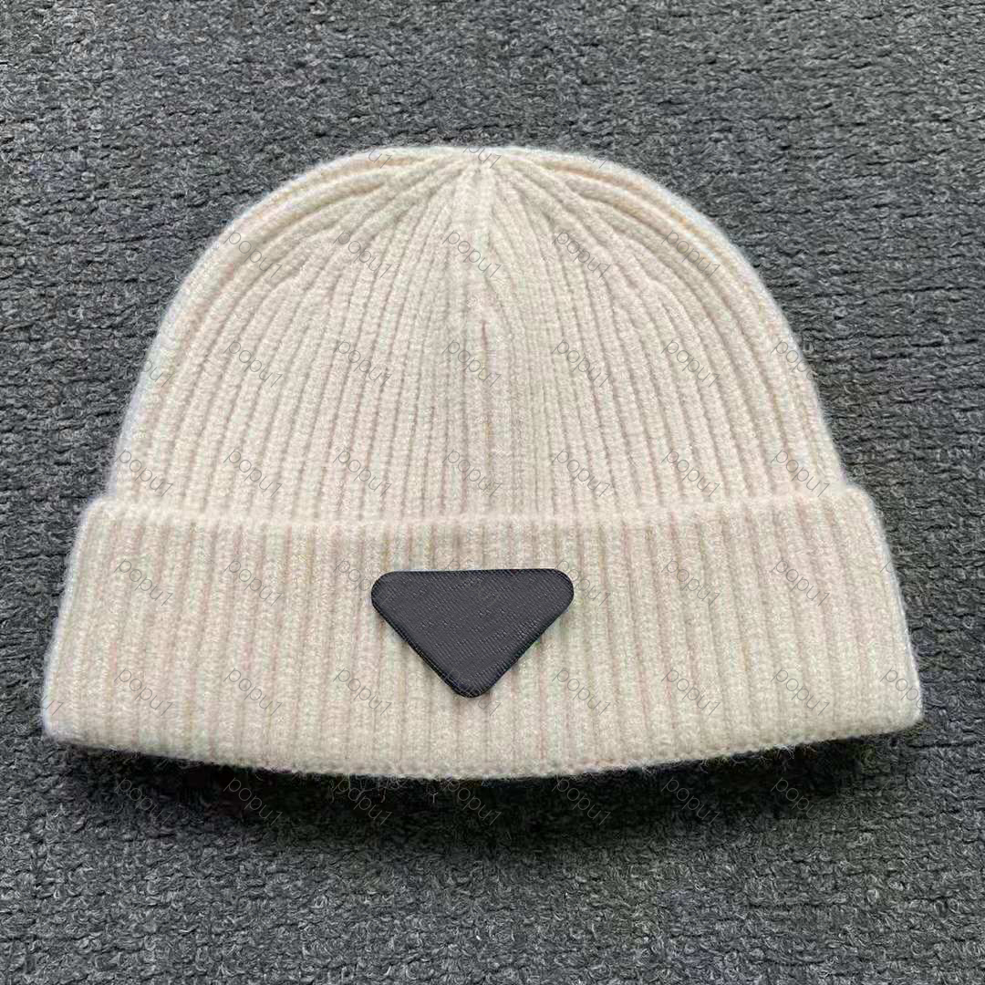 

2021 Fashion men's and women's design hats Winter knitted wool padded visor tassel beanie