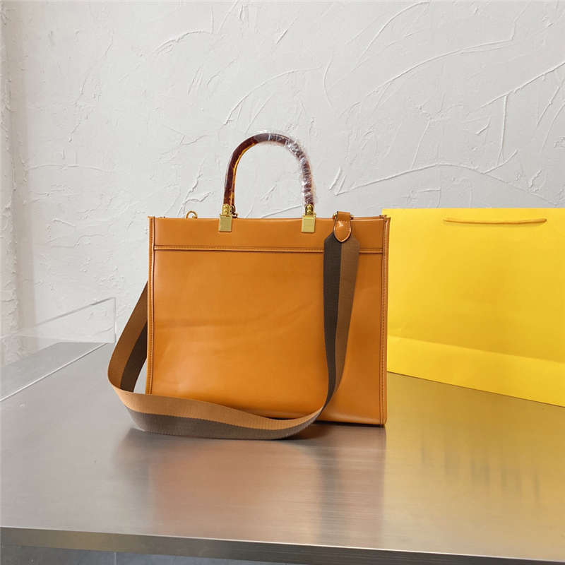 Femme Totes 21Ss Lettre Impression Sacs à main Sacs d'épaule Élégante Capacité Sac shopping Sac à main pour femmes avec bracelet Couleurs solides