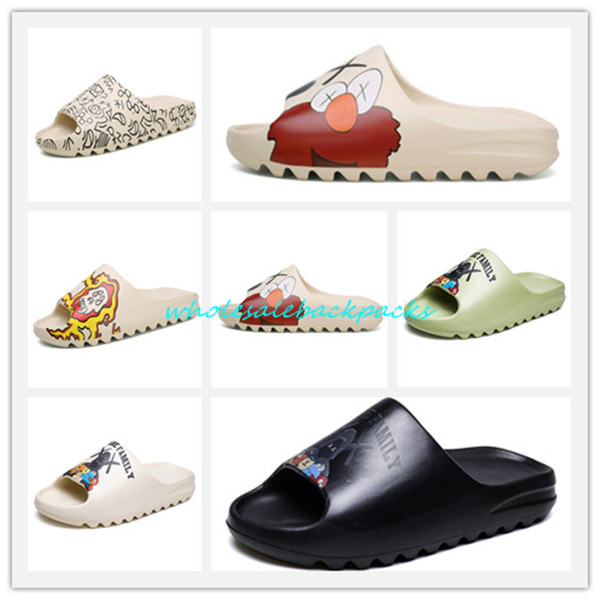 

Backpacks Kaws Slipper Kid's Men Women Slide Bone Earth Brown Desert Sand Resin designer shoes Sandals Foam Runner SESAME STREET Novelty Slippers sandal