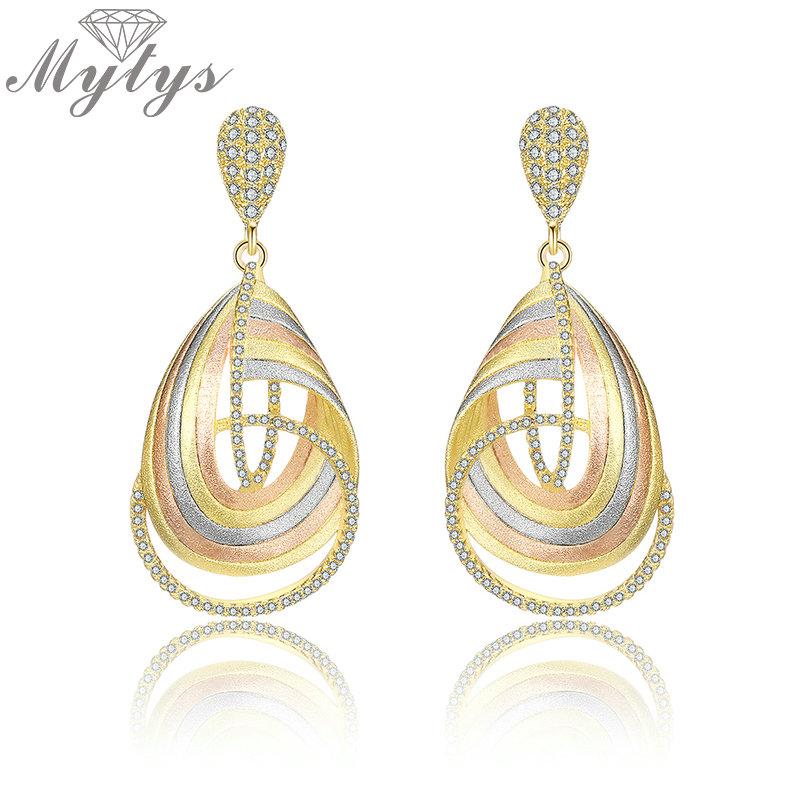 

Dangle & Chandelier Mytys Geometry Cross Three Tone Gold Earrings For Women High-end Craft Zirconia Setting Statement Jewelry CE497, Silver