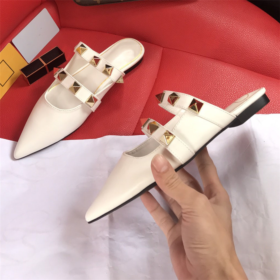 

2021 new spring and summer women pointed flat heel slippers European size 35-40 Roman rivet leather flat mules