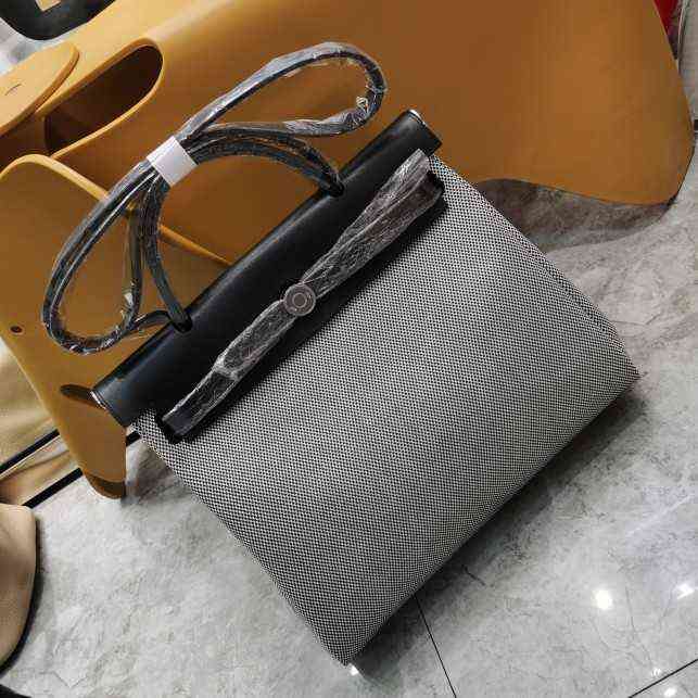 

Luxury Bag Herme Herbag canvas collage top layer cowhide portable messenger women's panda chessboard black and white lattice 31cm waterproof
