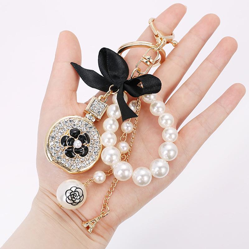 

Keychains Bow-Knot Imitation Pearl Perfume Crystal Bottle Iron Tower Chain Keychain Car Key Ring Bag Charm Accessories Girl Keyring Gift