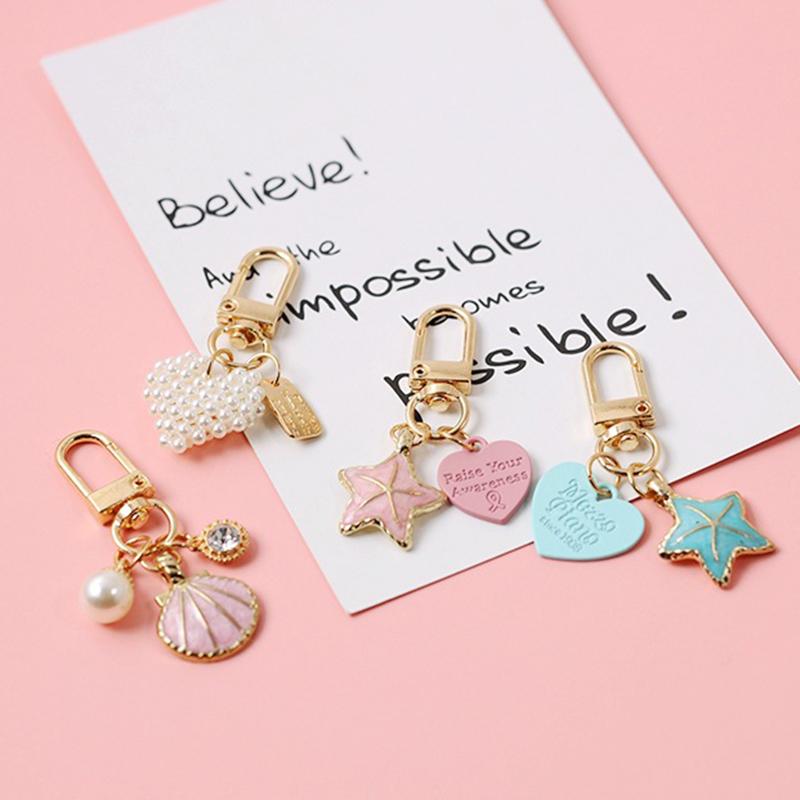 

Keychains Ins Five-pointed Star Shell Pendant Bluetooth Headset Case Key Chain Bag