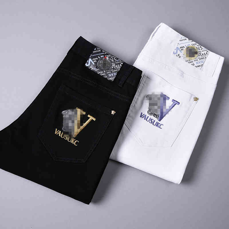 Men's Jeans Autumn and winter men's jeans pure black white high elastic small feet slim fitting Korean version simple Medusa embroidery NE