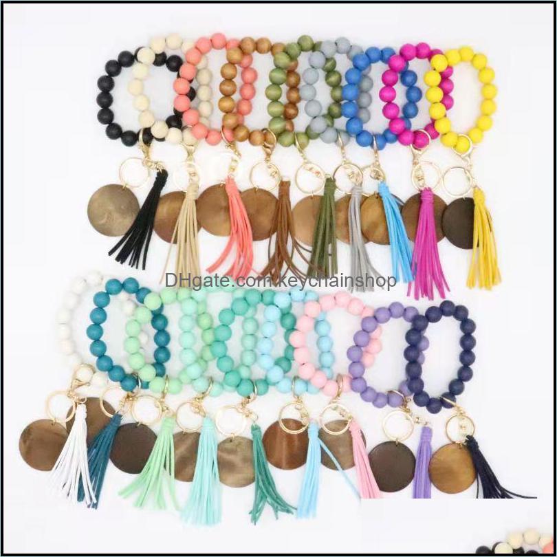 

Keychains Fashion Accessories Cross-Border Beaded Wooden Bead Keychain Personality Disc Tassel Bracelet Key Ring Female Wholesale Drop Deliv