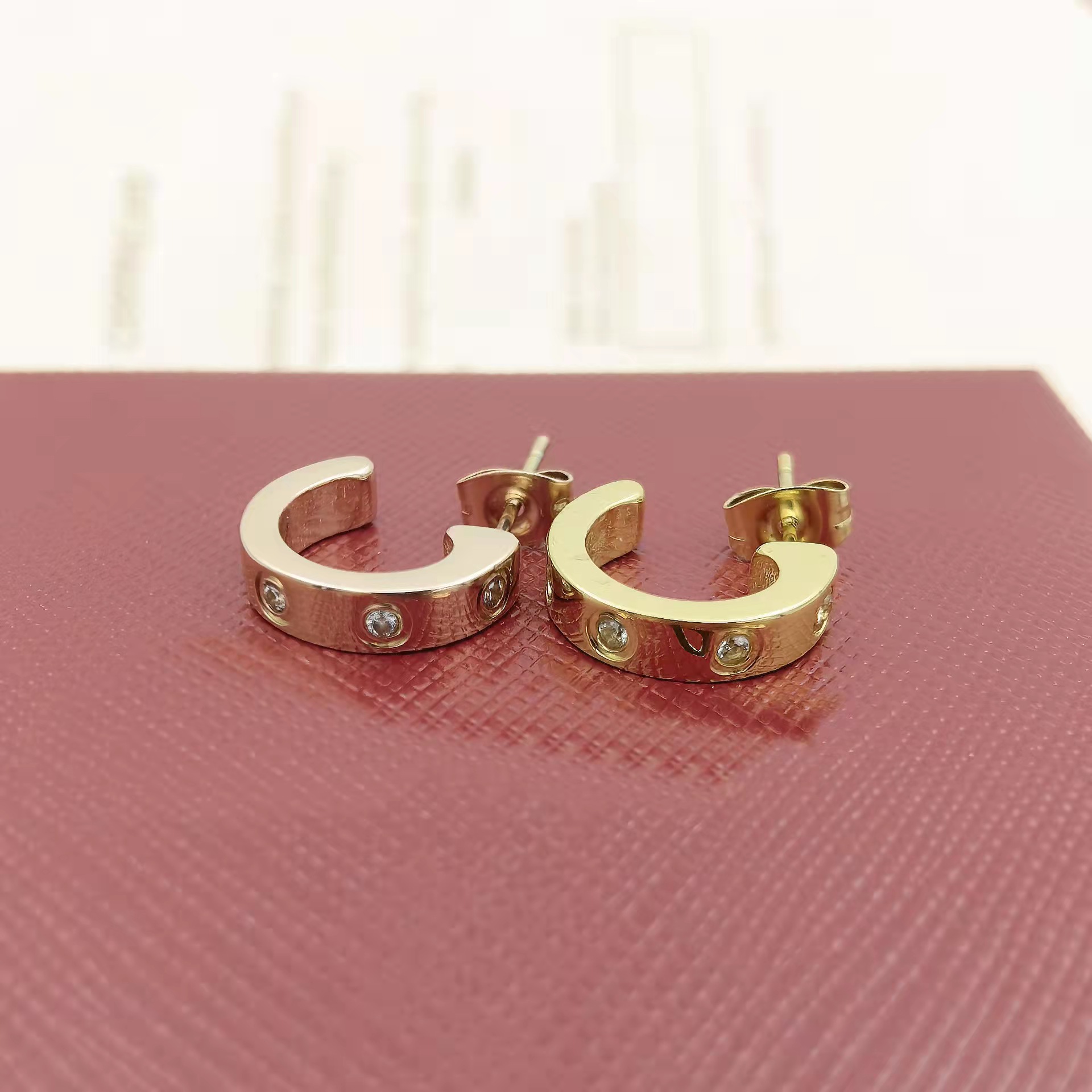 

Designer fashion earrings huggie Love earrings titanium steel electroplated 18K gold rose silver durable high quality colourless gift