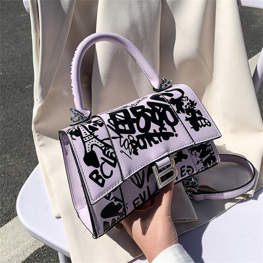 

62% OFF 2022 new trendy s New style personality trend graffiti one shoulder hand simple styling chain large capacity women's bag, White