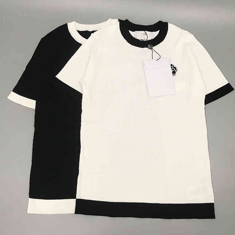 Tricot de tricot féminin Haute Version blanche Camellia tricot top le tempérament de style de style d'été Couleur Couleur de petit parfum à manch
