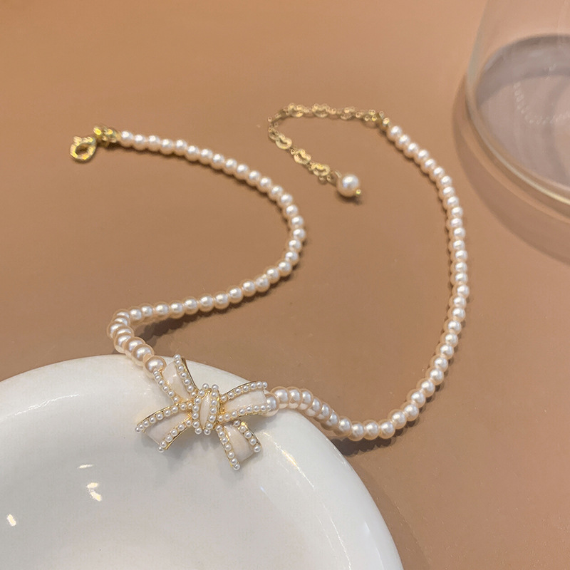 

Pearl Necklace Female Temperament Short Clavicle Chain Bow Neck Net Red French Bride
