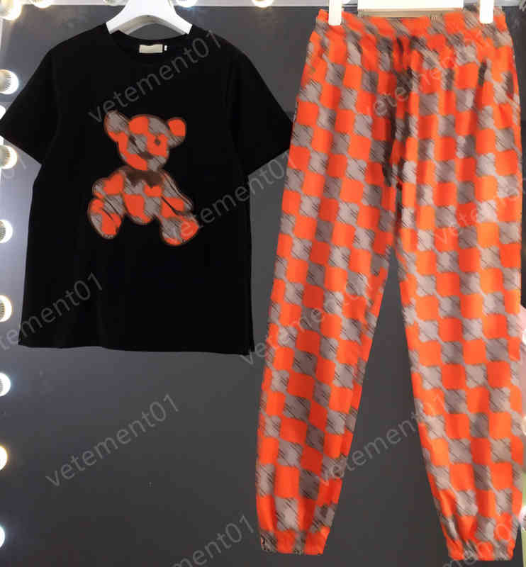 

Womens Two Piece Pants Trendy pull-through character print T-shirt and orange patchwork trousers Sets Luxury Designer Tracksuits Women Clothing 0912