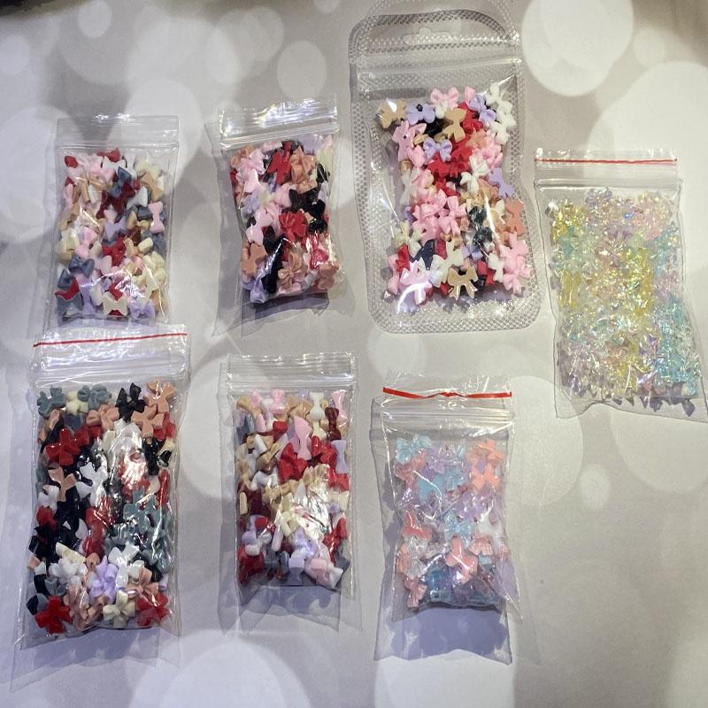 

Nail Art Decorations 100Pcs 7 Styles Bowtie Mixed Colors Charms Aurora Resin Gems Acrylic Nails UV Gel 3D DIY Crafts For DecorationNail