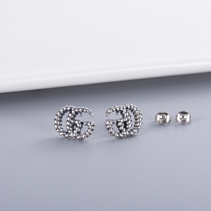 Top Luxury Designer Charms Boucles d'oreilles Backs de haute qualité en laiton Gold Oreau NOUVEAU COUPLE COURT