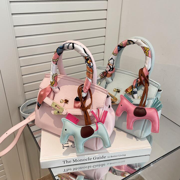 

Wholesale factory ladies leather shoulder bag quality summer macaroon color fashion handbags sweet cute cartoon pendant lychee pattern handbag