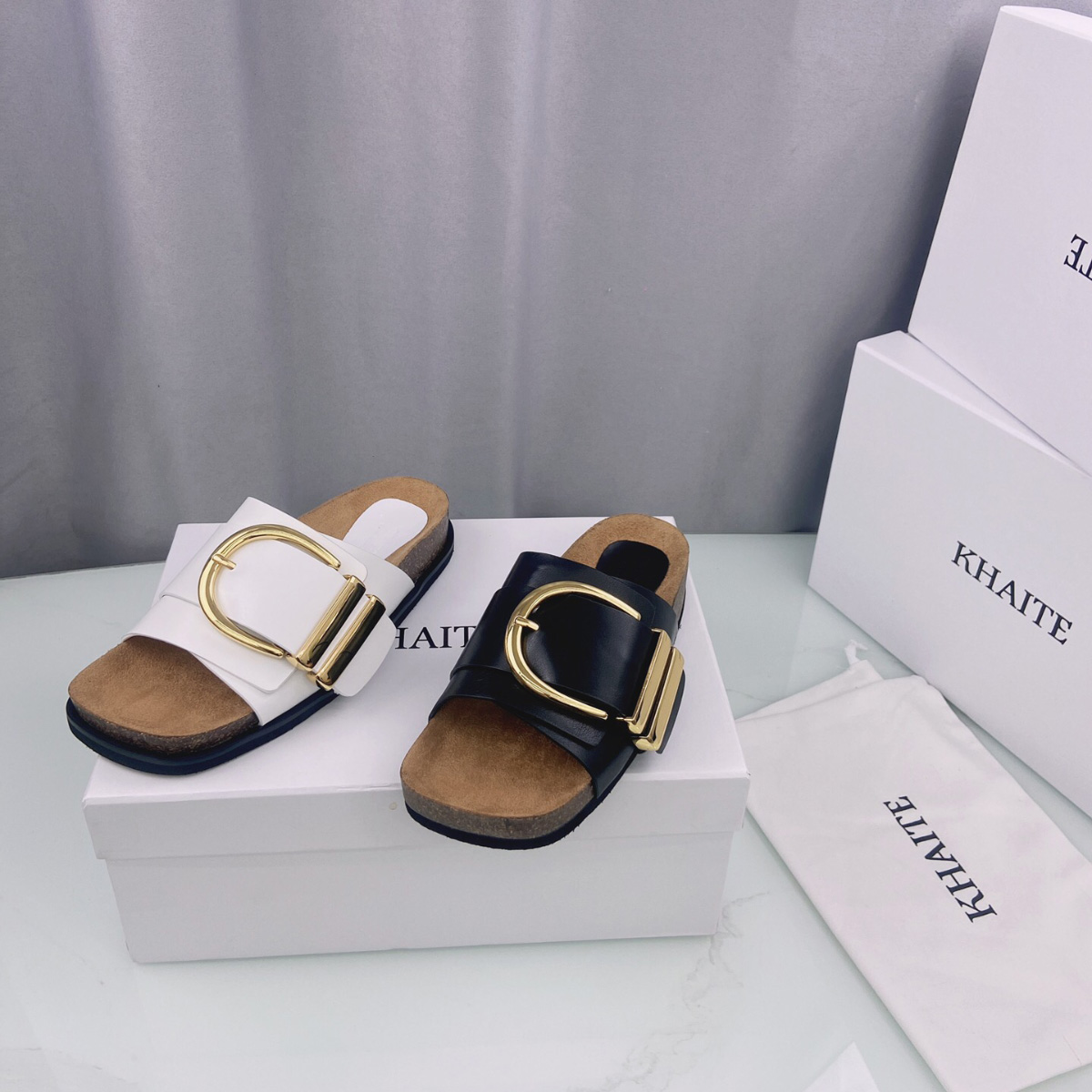 

Khaite Thompson buckled leather slides slippers Luxe slip-on beach sandals shoes Genuine leather open toe casual flats for women Luxury, Black