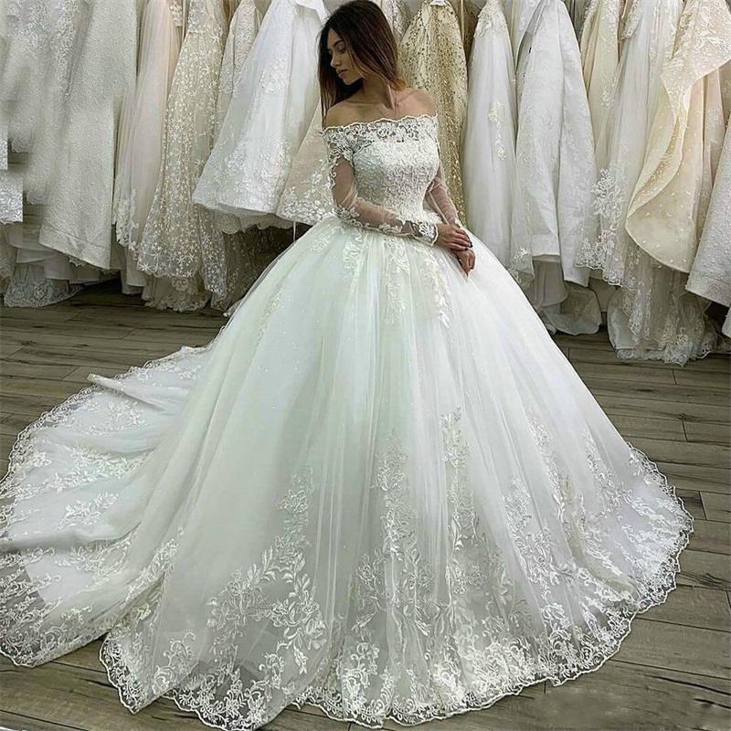 Autres robes de mariée château de luxe princesse Bouche à balle blanche à manches longues en dentelle applique noue couche robe nuptiale