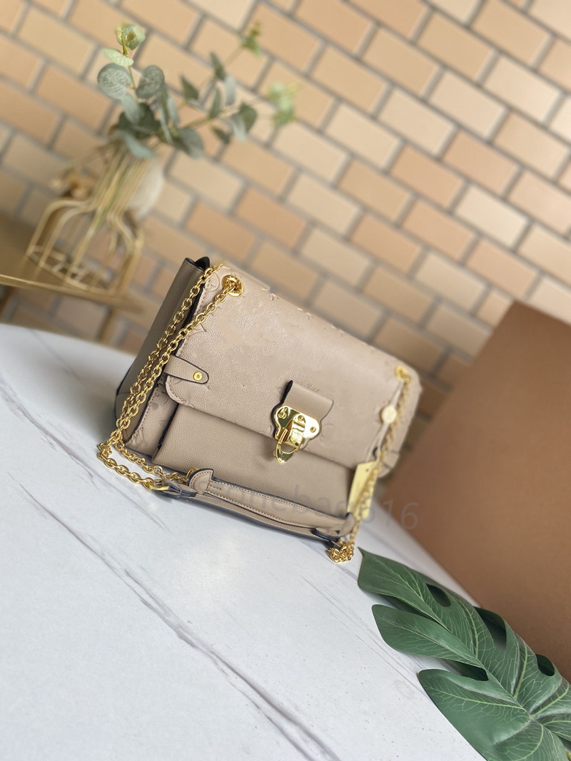 

Vavin Bags Metal Chain Cross Body Handle Embossed Monograms Leather Womens Shoulder Bag