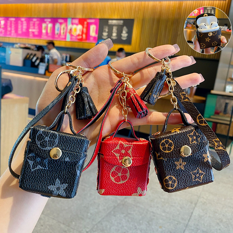 

Fashion Designer Airpods Case Keychains Trinkets PU Leather Key Rings Chains Jewelry Brown Flower Pendant Bag Charms Keyrings Car Keys Holder Fashion Accessories