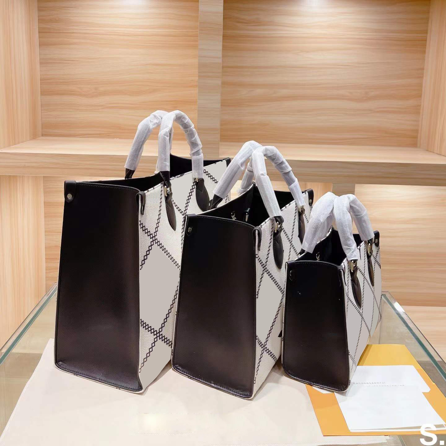 Fourre-tout marron en déplacement Luxurys Designers Sacs Femmes Sac à main à l'épaule Qualité Momie Sac Grande capacité Square Lettre Sac à main
