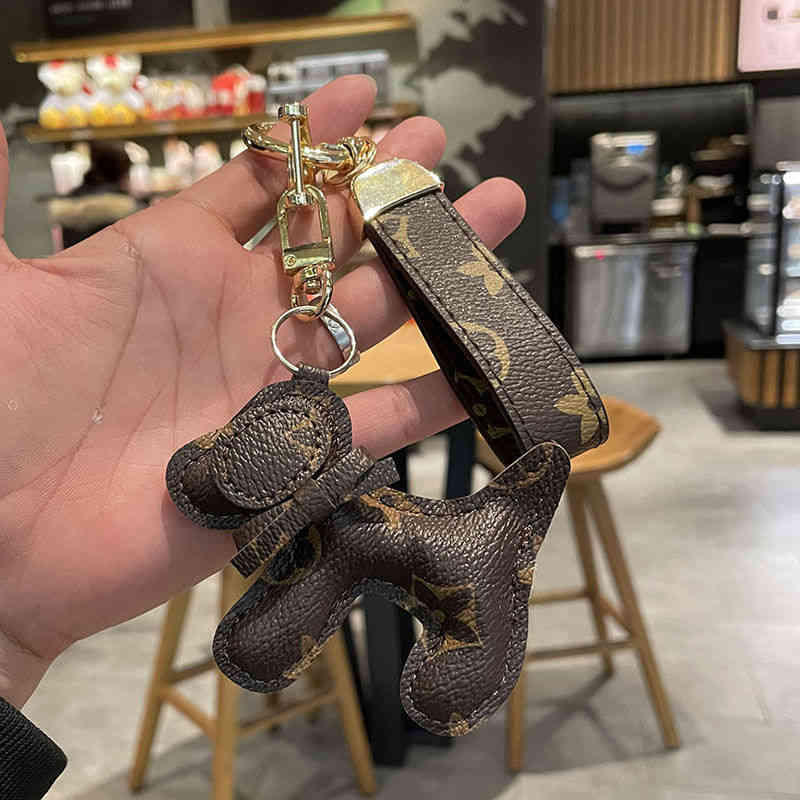 

Designer Sneaker Leather Silicone Keychains European American Trend Dog Net Red Creative Old Flower Car Male and Female Couple Bag Pendant