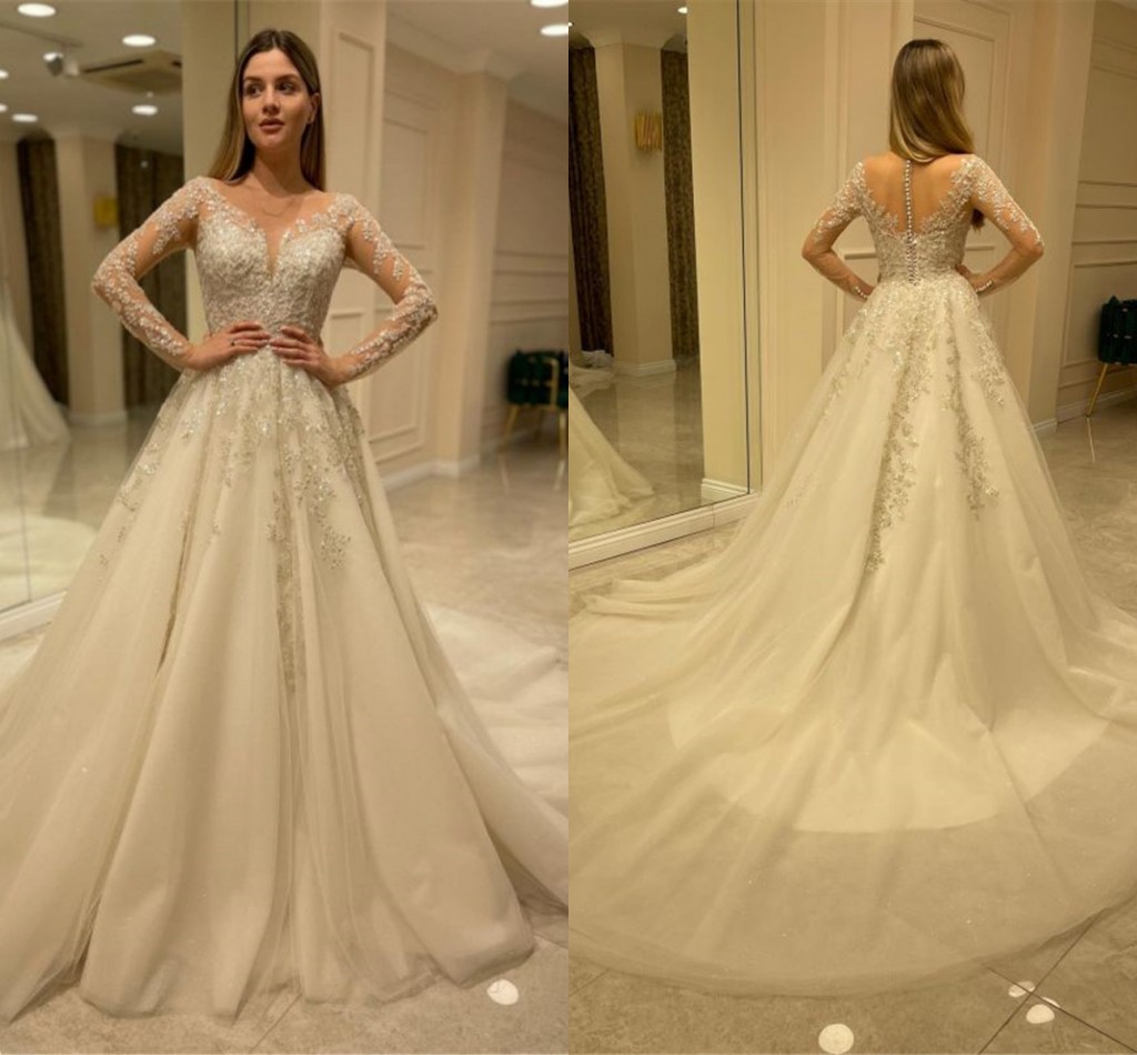 

Modest Illusion Long Sleeve Lace Wedding Dresses Appliques Beads A Line Sheer Neck Bridal Gowns With Button Covered Back Formal Robes, Champagne