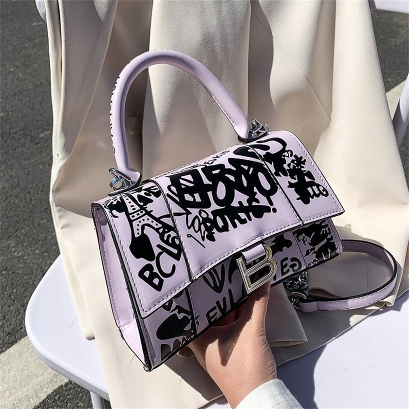 

56% OFF 2022 new trendy s New style personality trend graffiti one shoulder hand simple styling chain large capacity women's bag, White