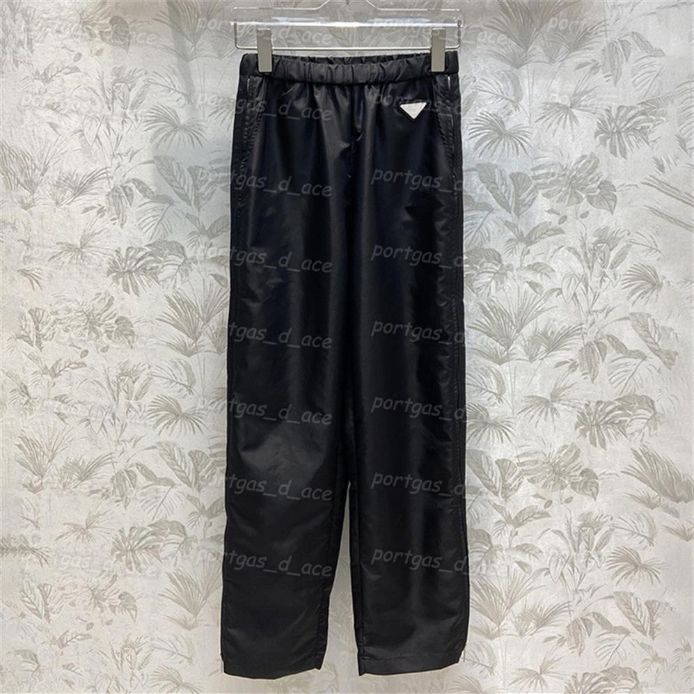 

Triangle Badge Womens Pants Re Nylon Elastic Waist Trouser Black Casual Fashion Zipper Design Slit Pants252f, Black with label #
