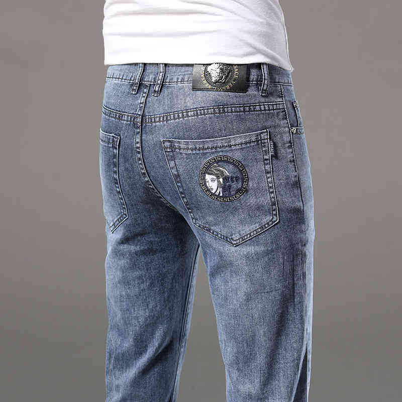 Men's Jeans men's spring and summer blue jeans slim fit small feet Korean pants Medusa embroidery 3FCI
