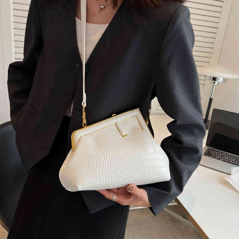 

Purses Outlet Fashionable personalized hand-held sling one shoulder women's new minority design advanced sense simple crocodile messenger clip mouth bag, White