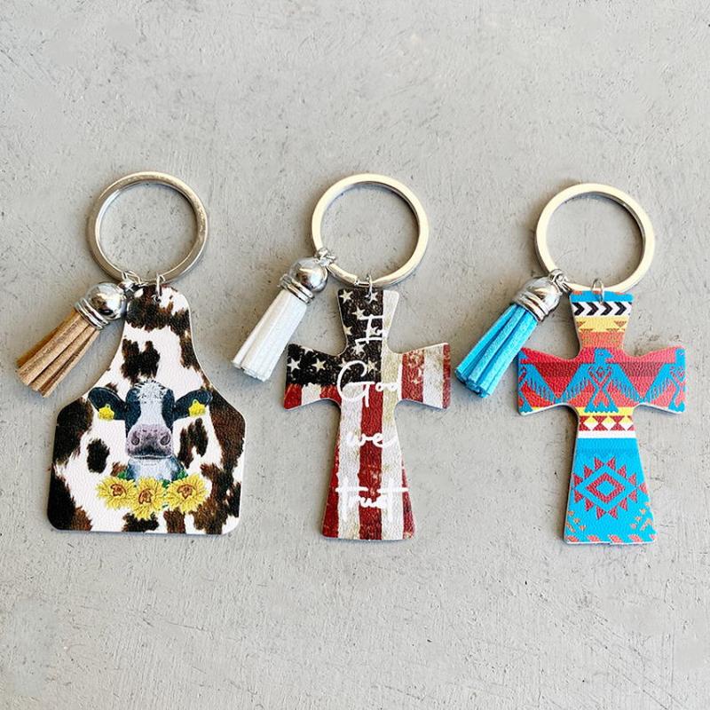 

Keychains Aztec Thunderbird Print Leather Cross Keychain Velvet Tassel Cow Ear Tag Key Chain Bag Charm Rings Wholesale